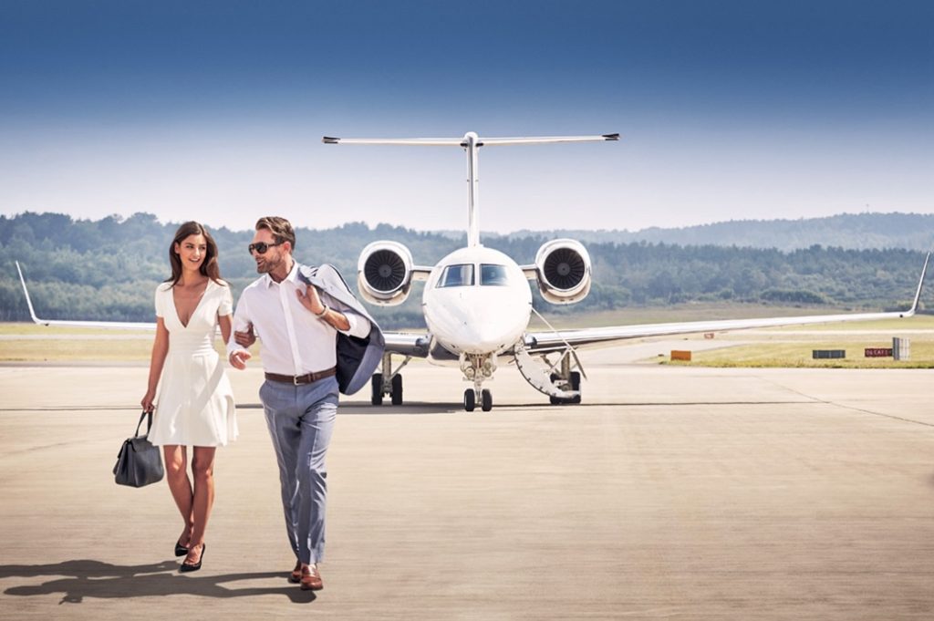 Man and woman private jet