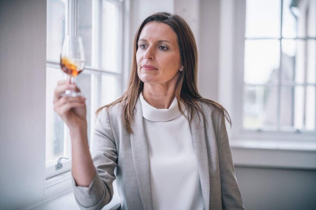 Woman holding scotch