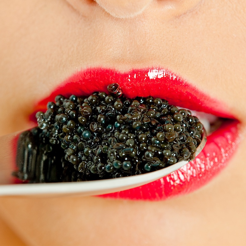 woman eating caviar