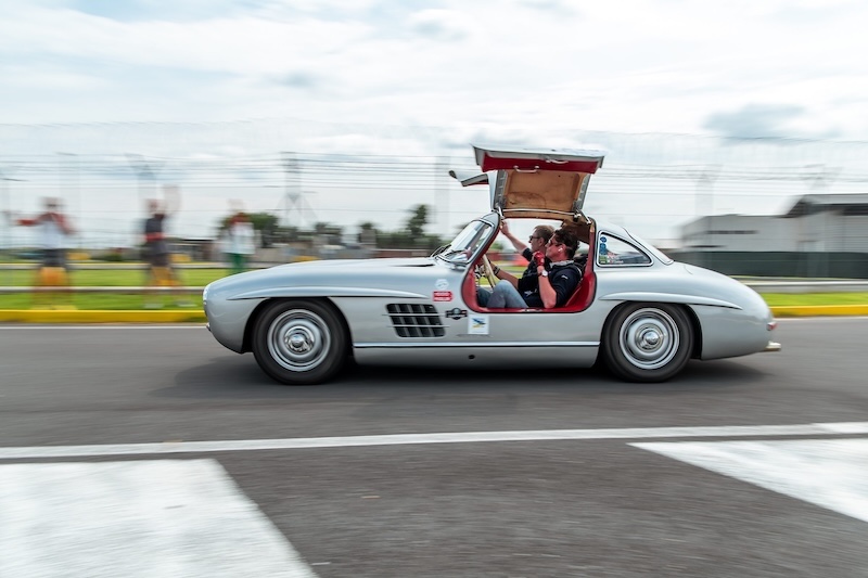 Silver Mercedes Gullwing with doors open.