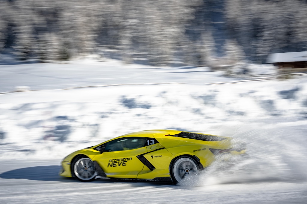 yellow car driven in the snow.