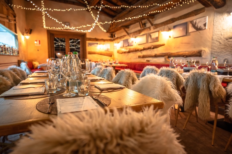 inside a cozy restaurant in the Italian Alps.